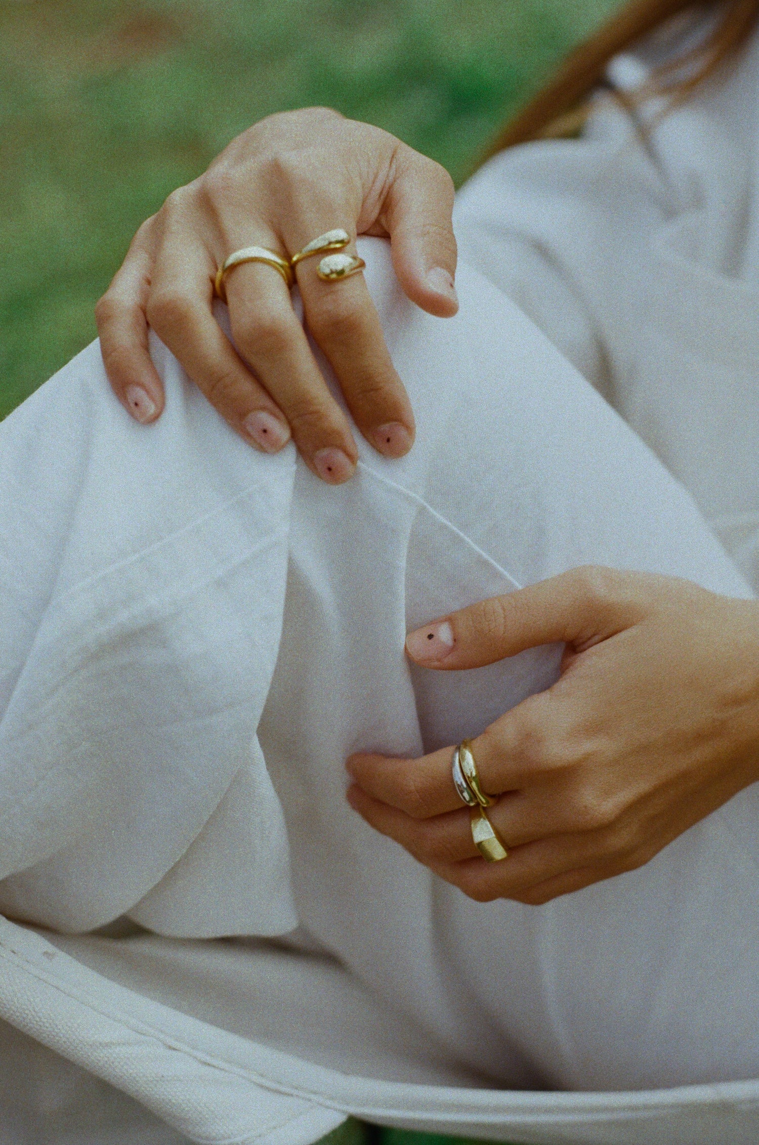 Gold rings and silver rings combined together in a ring stack