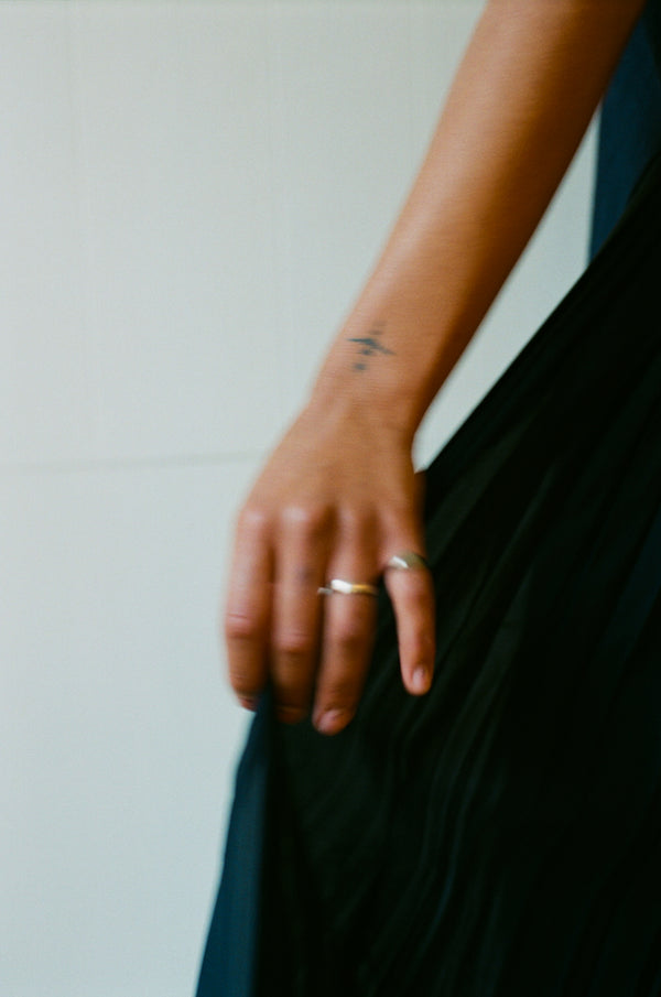 Aesthetic image with a hand tattoo and silver rings