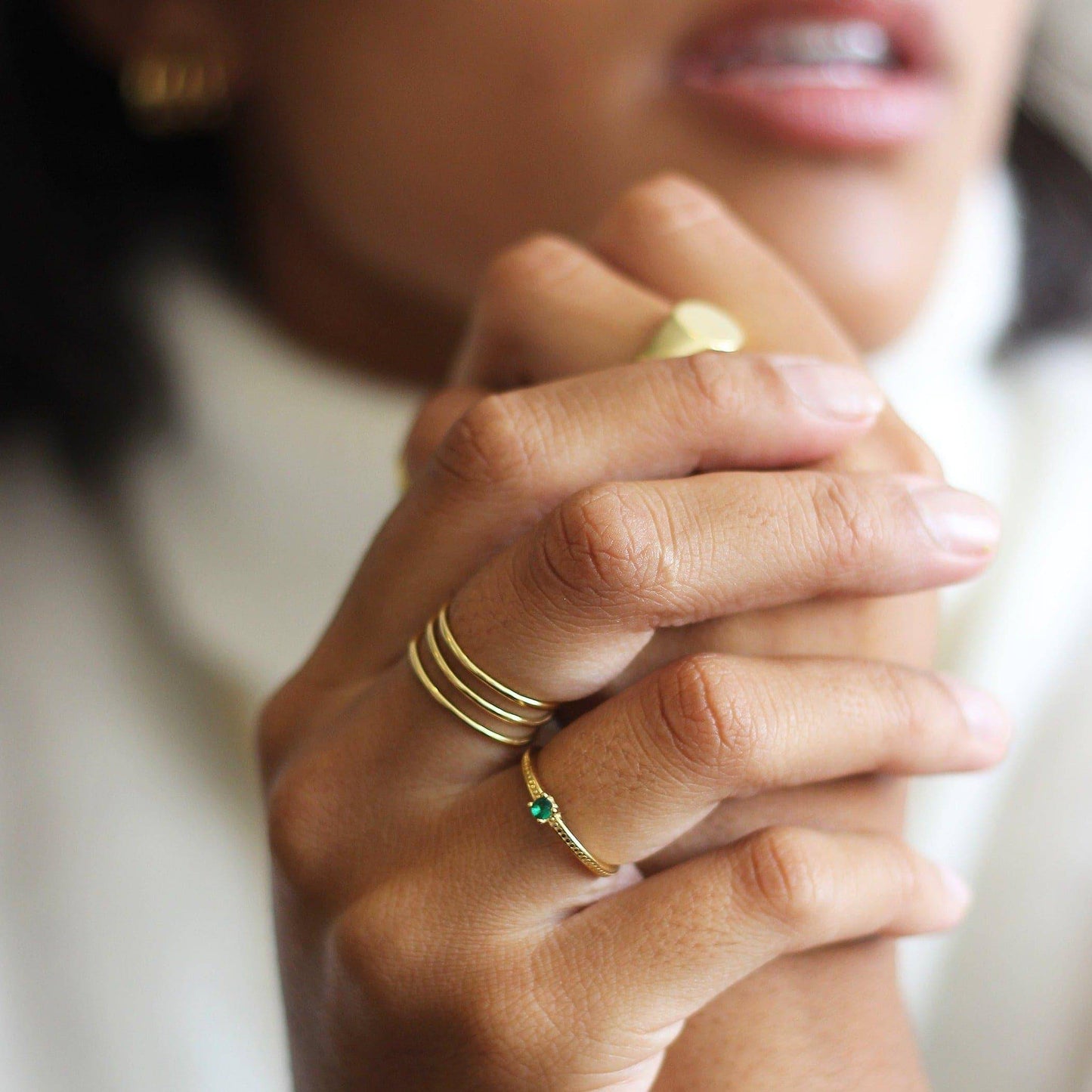 a close up of a person holding a doughnut 