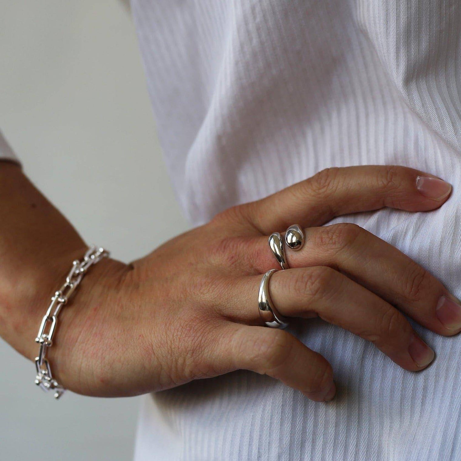 a person is holding a pair of scissors