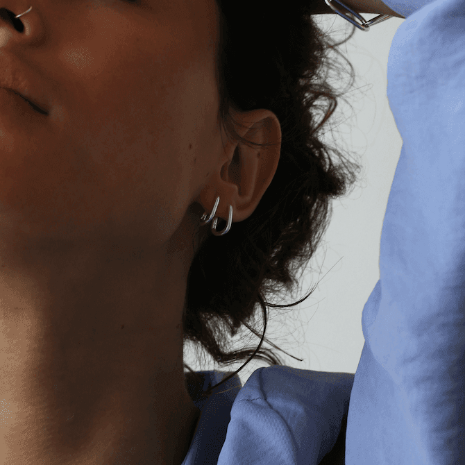 a woman holding a cell phone to her ear