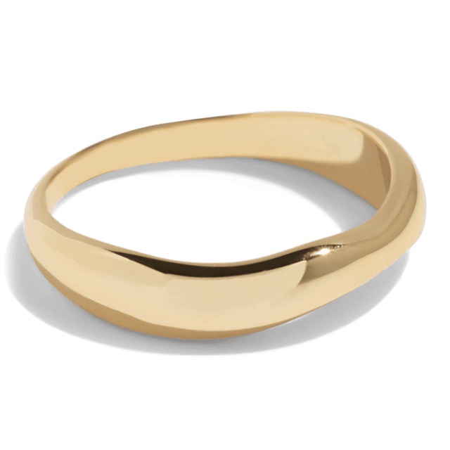Gold ring with a smooth, slightly irregular band, combining modern design with a minimalist look. This packshot highlights the ring's polished finish and unique shape