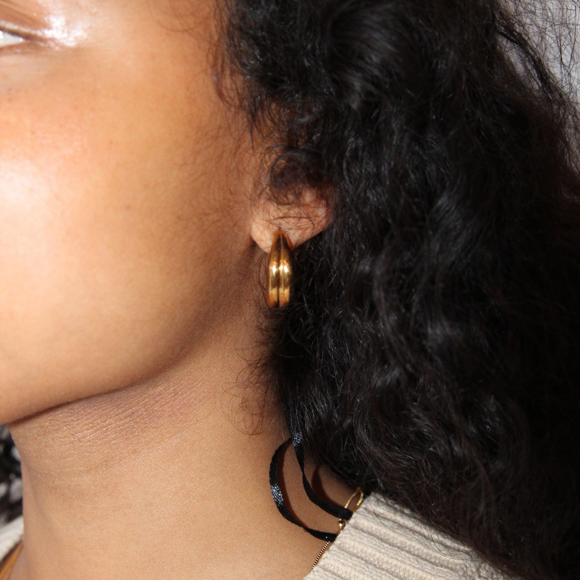 Bold large earrings with a double earring design